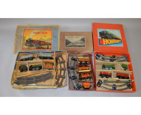 O Gauge. 3 x clockwork train sets. 2 x Hornby & 1 x Brimtoy. Overall F/G in P boxes.