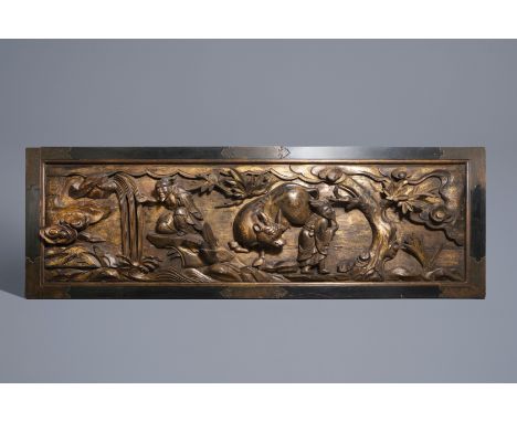 A large Chinese partly gilt carved wooden panel with a water buffalo, 19th C.--Work: 164 x 45 x 18 cmÊ Frame: 179 x 58 Ê Prov
