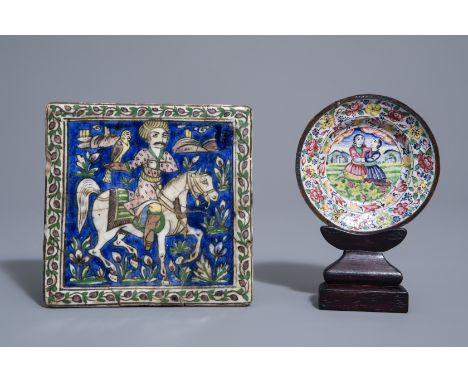 A tile with a falconer and an enamel saucer, Qajar, Iran, 19th C.--15,3 x 15 cm (the tile) Ê Dia.: 10,8 cm (the saucer) -- Pl