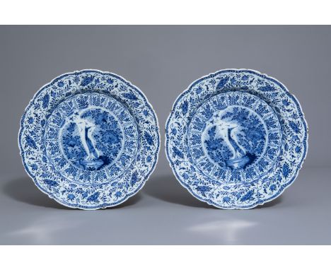 A pair of Dutch Delft blue and white chargers with a bird among blossoming branches, 18th C.--Dia.: 34,3 cmÊ Both chargers ma