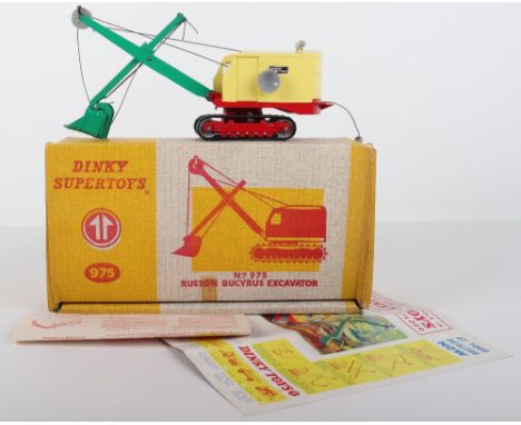 Dinky Toys 975 Ruston Bucyrus Excavator, pale yellow plastic body, red lower body, green jib, black rubber tracks, in mint or