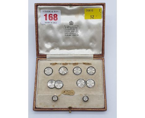 (NB) A French Deco white metal and enamel gentleman's dress set, comprising cuff links, four waistcoat buttons and two shirt 