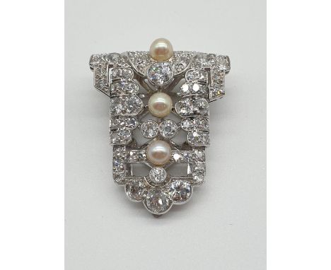(NB) An impressive Art Deco diamond and pearl clip, set with an estimated 5ct of brilliant and single cut diamonds, 34mm.
