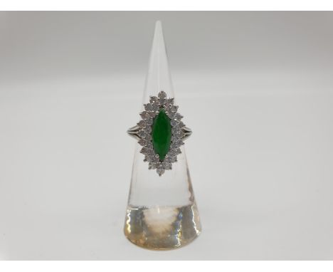 (NB)&nbsp;A marquise shaped white metal ring, set with a cabochon jade surrounded by a double row of brilliant cut diamonds o