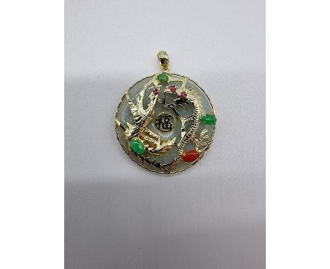 A modern 14ct gold jade and gem set dragon pendant, 32mm diameter. 