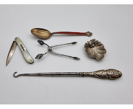 A Norwegian sterling gilt and red guilloche enamel spoon, by T H Marthinsen, 15cm; together with a pair of silver sugar nips;