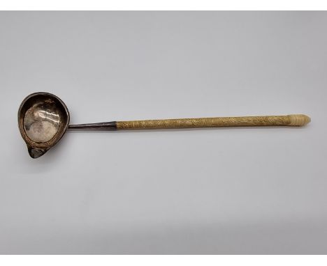 A George III silver ladle having carved ivory handle, by Thomas Shepherd, London 1780, 34cm. 