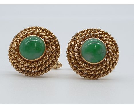 (NB) A pair of yellow metal cufflinks, each set with a cabochon jade to centre with a triple rope border, stamped 14k, gross 
