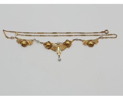 (NB) A French Art Nouveau cast and chased yellow metal necklet, decorated with and&nbsp;roses and leaves and set seed pearls,