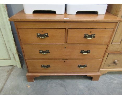 A 19th Century pine two over two drawer chest of drawers with brass handles on bracket feet, 96cm wide