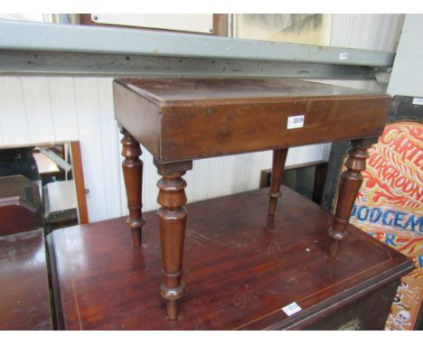 A George III mahogany bidet with ceramic liner