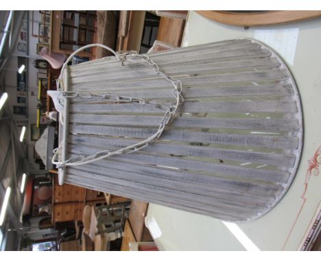 A large white painted hanging light     