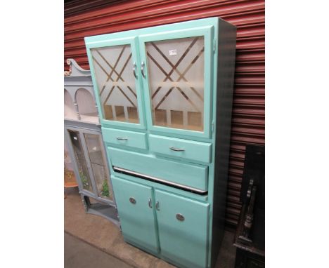 A mid 20th Century painted kitchen cabinet with pull out enamel work top 