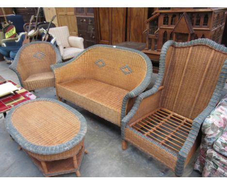 A 1960s bamboo and rattan two seater sofa, two chairs and a coffee table 