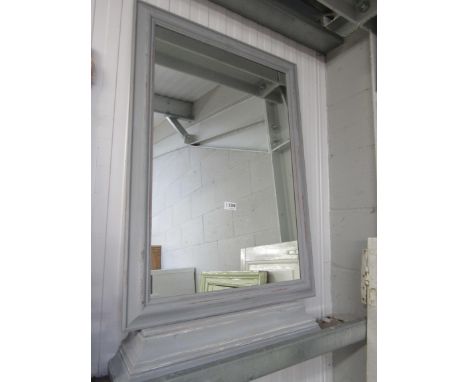 A grey painted wall mirror and console wall shelf