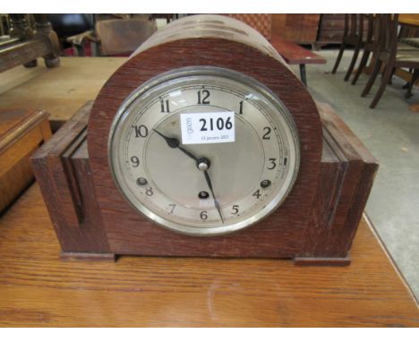 A 1950's oak mantel clock