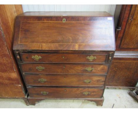 A George III mahogany bureau, fall front over four graduating long drawers, bracket feet a/f 