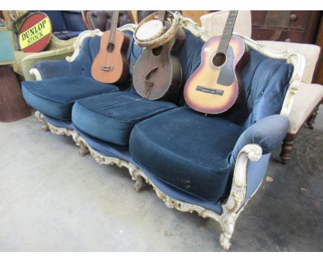 A 1930s cream, green and gilt painted and carved show wood sofa frame for re-upholstery 