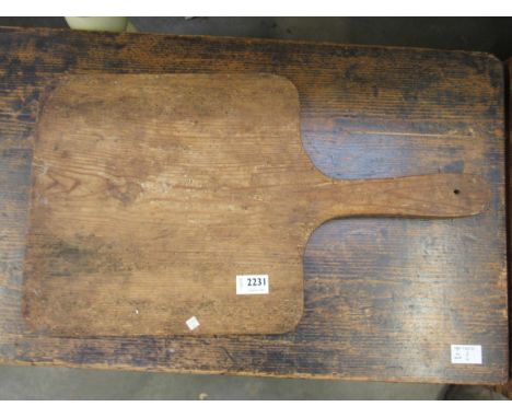 A rustic pine bread board