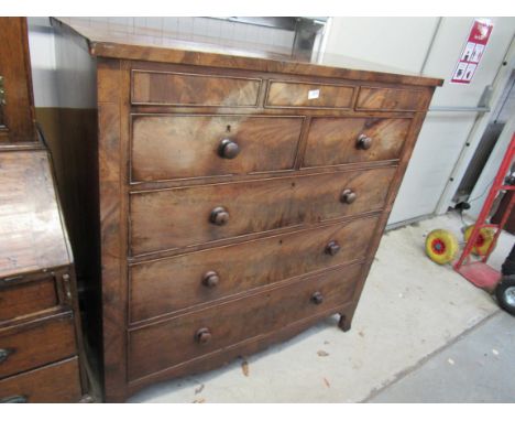 A George III flame mahogany chest of two secret drawers over two short and three long on outswept bracket feet     