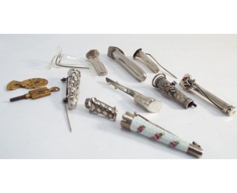 Group of silver and engine turned enamelled posy holder decorated with rose garlands, together with Edwardian posy holders in