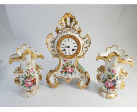 3 piece porcelain French clock garniture - the clock with white enamel dial signed Valery Paris, clock with key and pendulum,