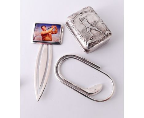 Three silver golfing theme items - a bookmark with retro style enamel panel, money clip and a rectangular embossed pill box