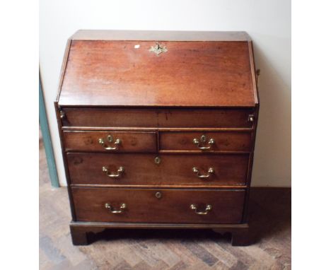 18th century oak bureau with well fitted interior with well; 2 long and 2 short drawers under standing on bracket feet, 3' wi