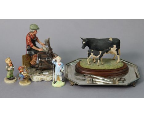 A Royal Doulton bone china figure "Little Boy Blue" (HN 2062); together with two Goebel Hummel figures; a silver plated engra