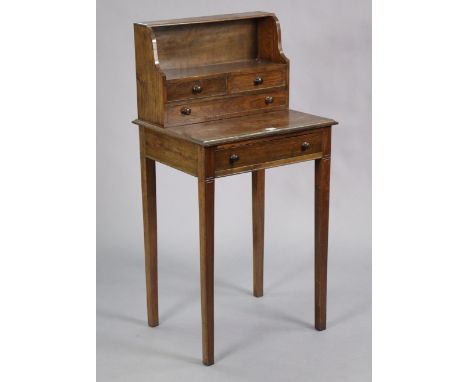 A teak small side table fitted four small drawers &amp; an open shelf to the stage back, fitted frieze drawer, &amp; on squar