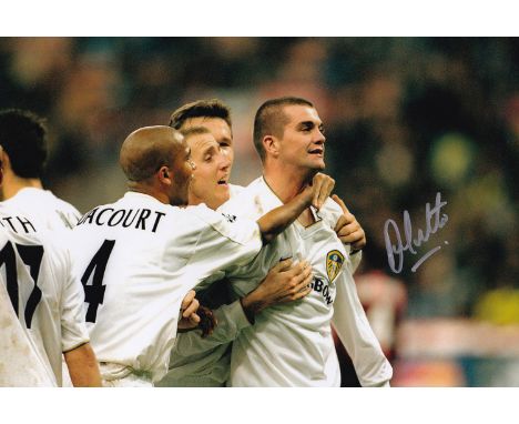 Autographed DOMINIC MATTEO 12 x 8 photo : Col, depicting Leeds United centre-half DOMINIC MATTEO celebrating with team mates 