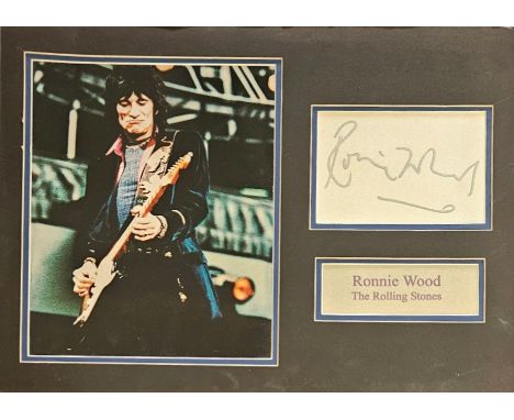Ronnie Wood signed white card, mounted with name plaque and colour photo. English rock musician, best known as a member of th