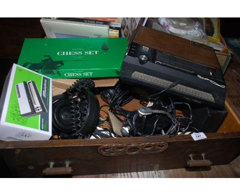 A quantity of microphones (Phillips omni-directional SBC 3012, Academy E-2007, K-100 Knight, etc.), headsets, chess set etc