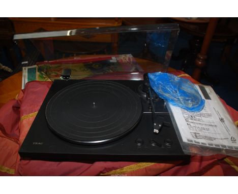 A Teak record player, no speakers.