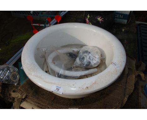 A circular wash basin and fittings, 18 1/2" diameter x 7" high.