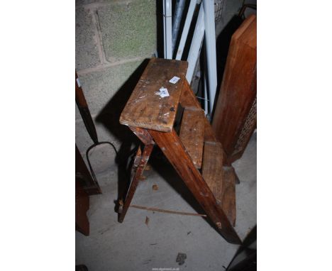 A wooden 4 rung step ladder.