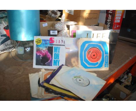 A box of books and records, doorstop, lamp, etc, (45 rpm records to include Slade and Moody Blues).