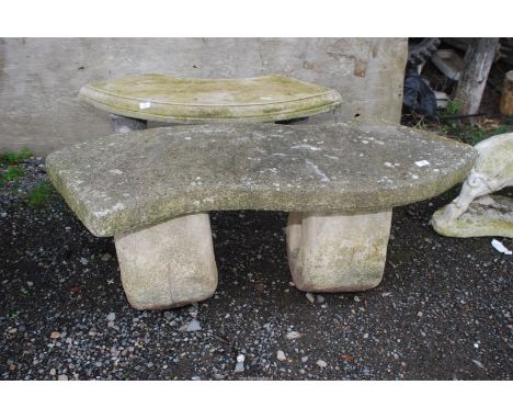 A shaped concrete bench, 4' wide x 18" high.