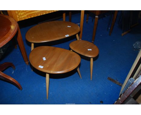 A nest of Three Ercol pebble shaped tables.
