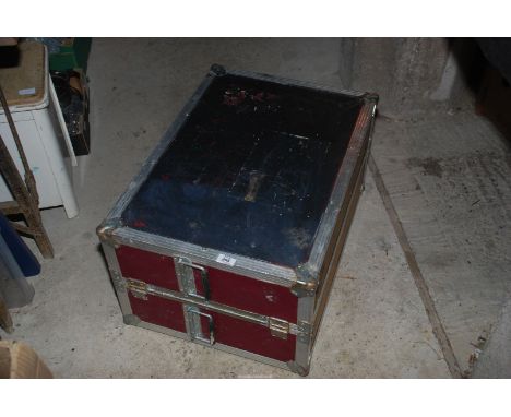 A metal bound trunk with contents.