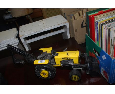 A Tonka Tractor with loading shovel and back acktor.