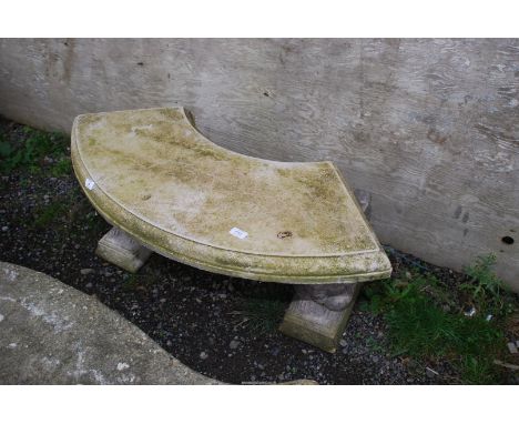 An arch shaped concrete bench with squirrel/animal pillars, 40" wide x 18" high.