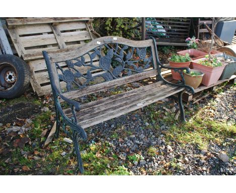 A Berkeley Garden bench with cast iron ends, 50" wide x 35" high.
