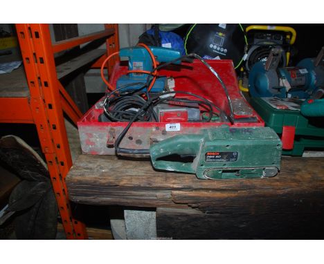 Three sanders including a Bosch, a 240 volt, (running), nail gun and a Black &amp; Decker belt sander (not working).