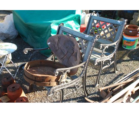 A pair of cast iron framed wooden slatted bench seats, 23" wide x 33" tall, plus wooden plaque and a riddle a/f.
