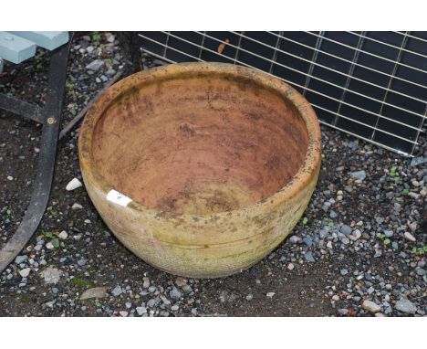 A terracotta round planter, 15 1/2" wide x 8" high.