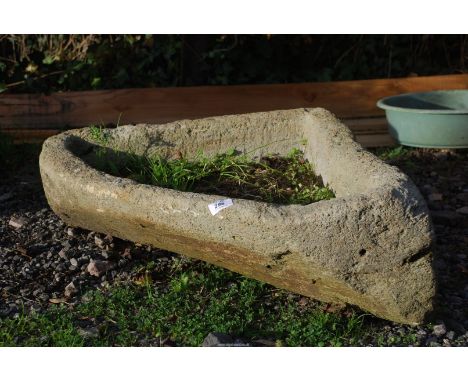 A concrete Corner planter, 21" front to back x 33" wide.