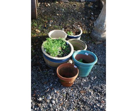 Five glazed planters and one terracotta planter.