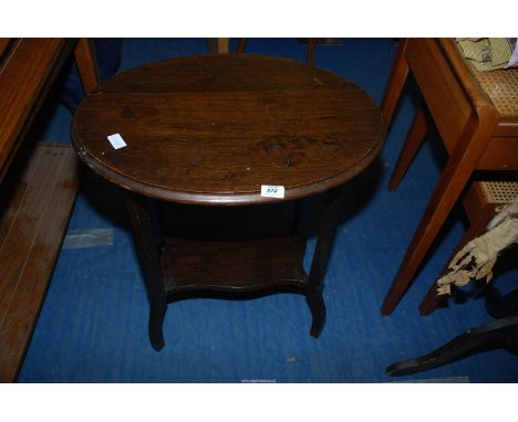 A darkwood oval Occasional Table with lower shelf 27'' high.