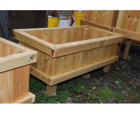 A rectangular wooden planter, 36 1/2" x 18 1/2" x 16" high.